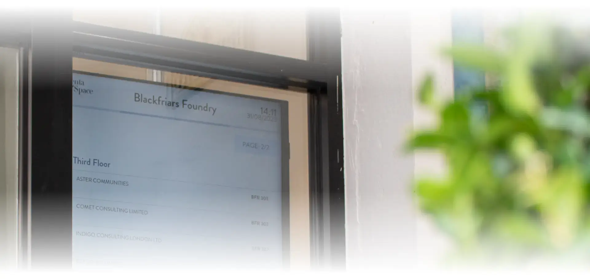twiinconcierge directory screen on a wall in a workspace