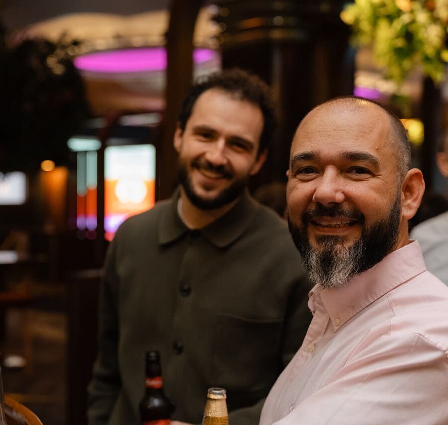 Two guests smiling at a GCUC evening event