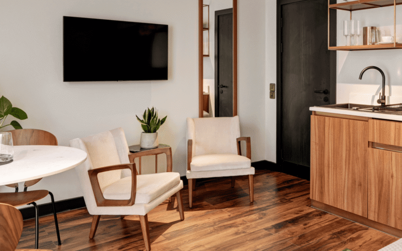 Furnished office suite with a kitchenette and lounge chairs