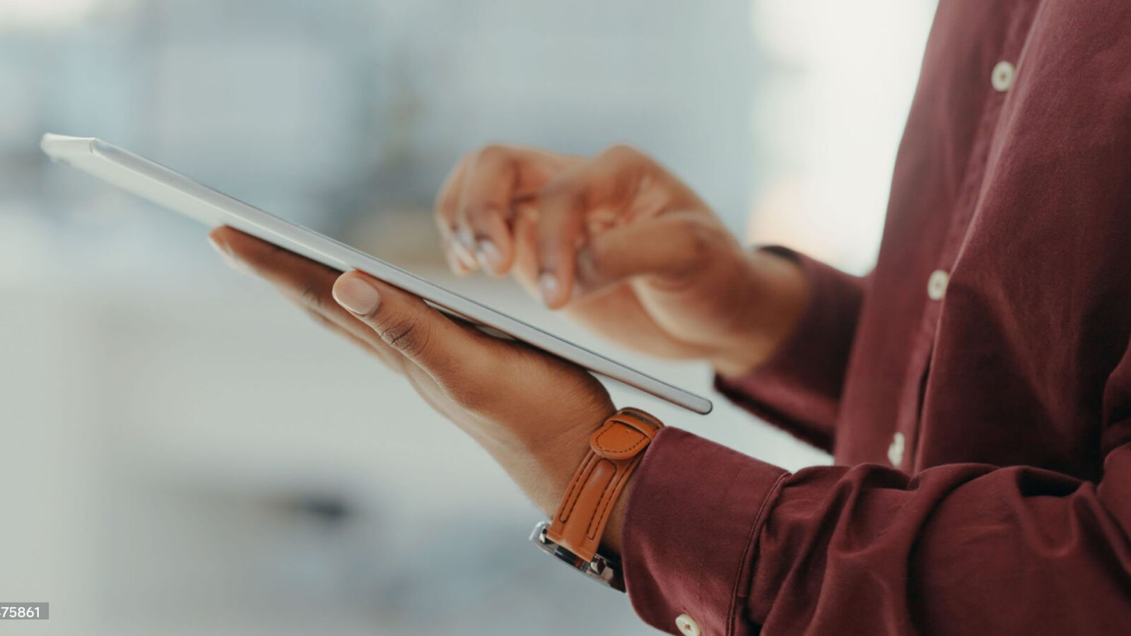Close-up of hands using a tablet