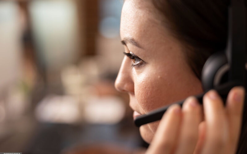 Support agent wearing a headset