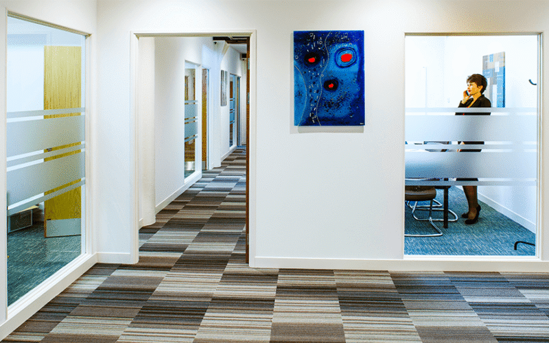 UBC office corridor with glass-fronted rooms
