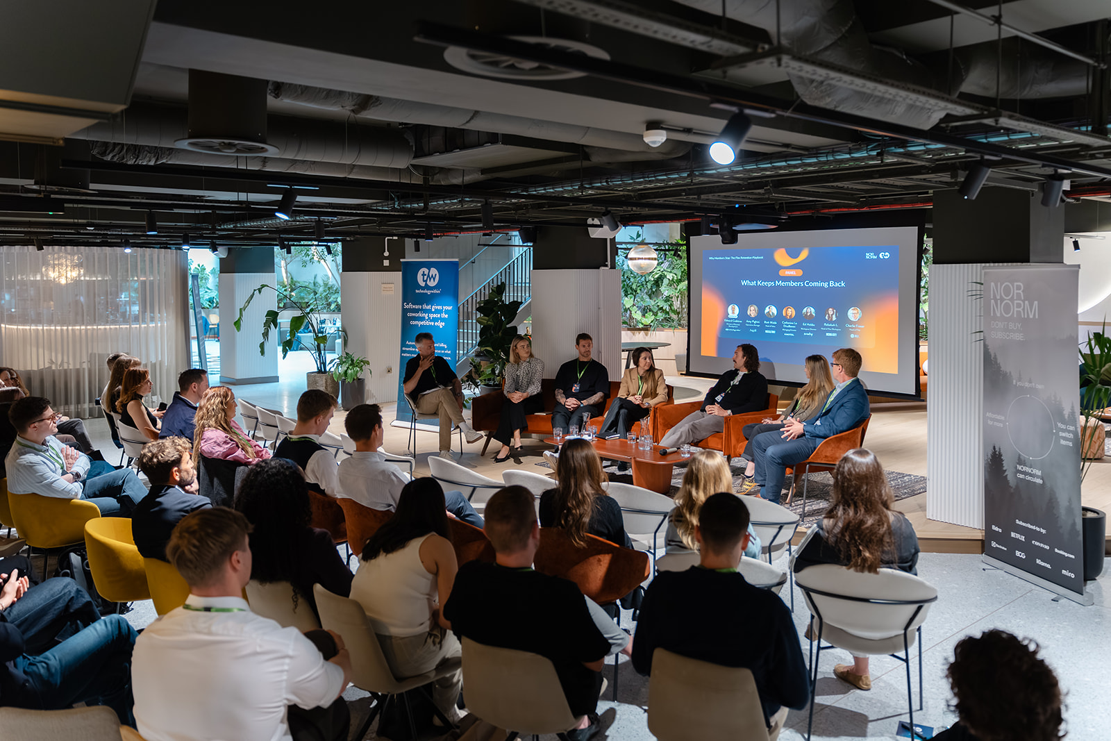 Audience watching a panel discussion at a twiin event